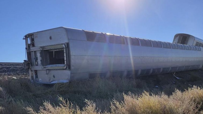 In this photo provided by Kimberly Fossen people work at the scene of an Amtrak train derailment on Saturday, Sept. 25, 2021, in north-central Montana. Multiple people were injured when the train that runs between Seattle and Chicago derailed Saturday, the train agency said. (Kimberly Fossen via AP)