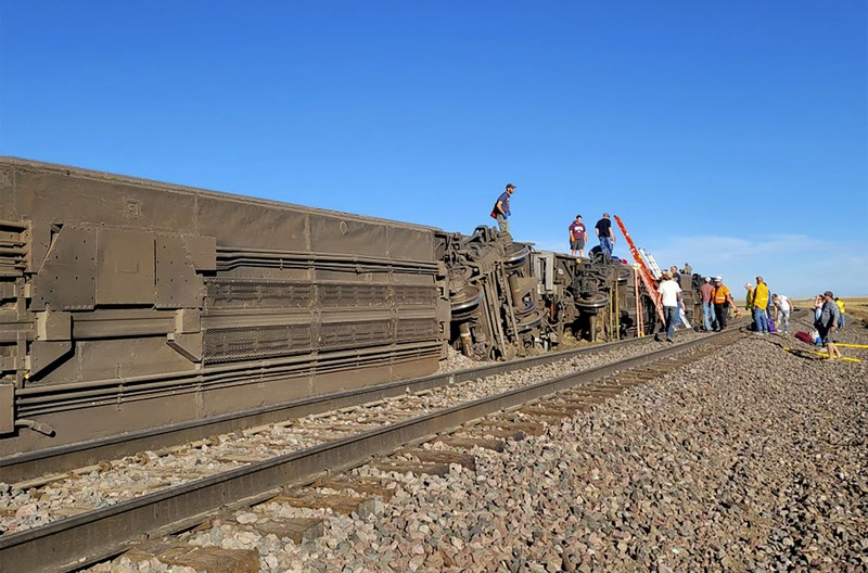 In this photo provided by Kimberly Fossen people work at the scene of an Amtrak train derailment on Saturday, Sept. 25, 2021, in north-central Montana. Multiple people were injured when the train that runs between Seattle and Chicago derailed Saturday, the train agency said. (Kimberly Fossen via AP)
