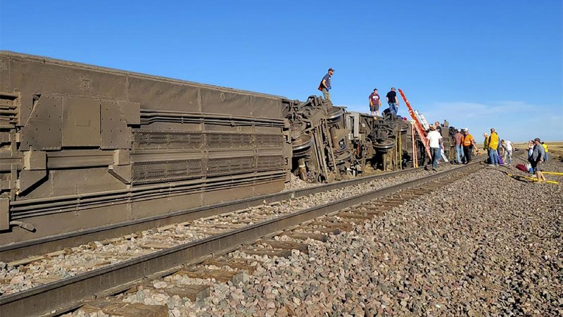 In this photo provided by Kimberly Fossen people work at the scene of an Amtrak train derailment on Saturday, Sept. 25, 2021, in north-central Montana. Multiple people were injured when the train that runs between Seattle and Chicago derailed Saturday, the train agency said. (Kimberly Fossen via AP)