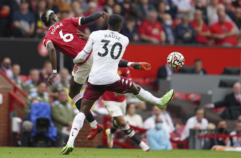 Manchester United's Cristiano Ronaldo, center, in action during the English Premier League soccer match between Manchester United and Aston Villa at the Old Trafford stadium in Manchester, England, Saturday, Sept 25, 2021. (AP Photo/Jon Super)