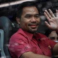 Mantan petinju Manny Pacquiao yang kini jadi senator resmi mendaftar sebagai calon presiden di komisi pemilihan umum Filipina 2022. (REUTERS/ELOISA LOPEZ)