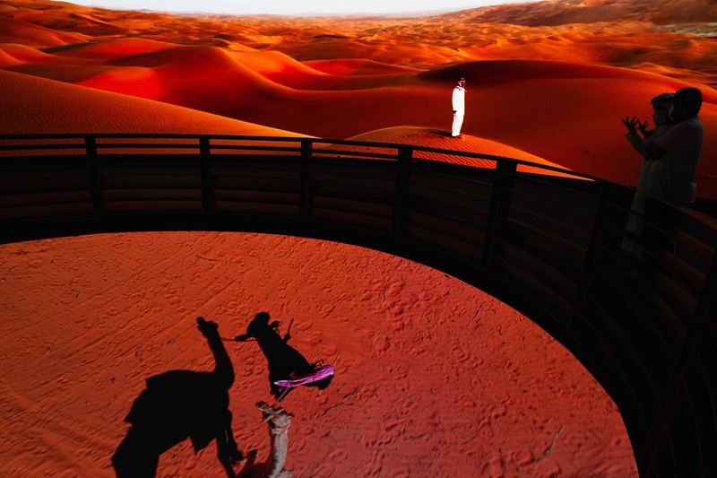 People visit the Russia pavilion during the first day of the Dubai Expo 2020 in Dubai, United Arab Emirates, Friday, Oct, 1, 2021. (AP Photo/Kamran Jebreili)