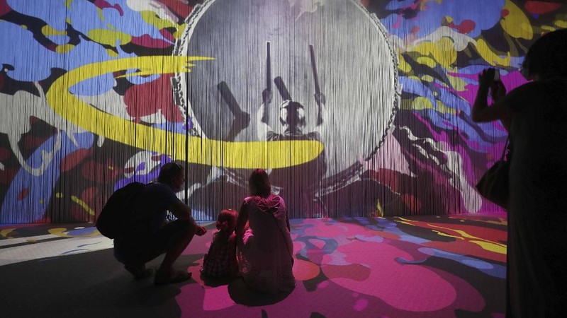 People visit the Russia pavilion during the first day of the Dubai Expo 2020 in Dubai, United Arab Emirates, Friday, Oct, 1, 2021. (AP Photo/Kamran Jebreili)