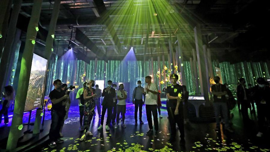 People visit the Russia pavilion during the first day of the Dubai Expo 2020 in Dubai, United Arab Emirates, Friday, Oct, 1, 2021. (AP Photo/Kamran Jebreili)
