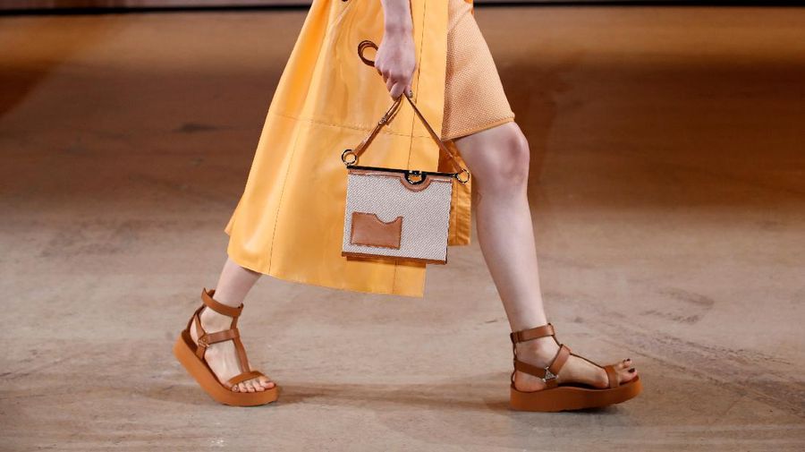 A detail of a purse as a model presents a creation by designer Nadege Vanhee-Cybulski as part of a Spring/Summer 2022 women's ready-to-wear collection show for fashion house Hermes during Paris Fashion Week in Paris, France, October 2, 2021. REUTERS/Gonzalo Fuentes