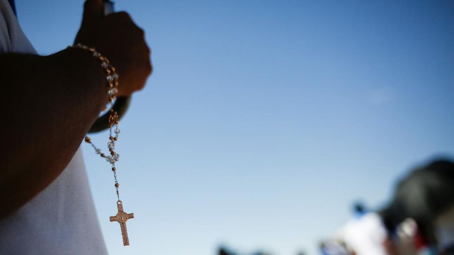 A rosary is held by a woman during a protest against Mexico's Supreme Court of Justice of the Nation (SCJN), which ruled that criminalising abortion is unconstitutional, in Ciudad Juarez, Mexico, October 3, 2021. REUTERS/Jose Luis Gonzalez