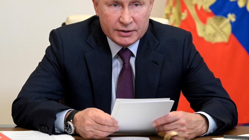 FILE - Russian President Vladimir Putin chairs a Security Council meeting via video conference at the Novo-Ogaryovo residence outside Moscow, Russia, in this Monday, Sept. 27, 2021, file photo. Hundreds of world leaders, powerful politicians, billionaires, celebrities, religious leaders and drug dealers have been stashing away their investments in mansions, exclusive beachfront property, yachts and other assets for the past quarter century, according to a review of nearly 12 million files obtained from 14 different firms located around the world. The report released Sunday, Oct. 3, 2021 by the International Consortium of Investigative Journalists involved 600 journalists from 150 media outlets in 117 countries. Russian President Vladimir Putin is one of 330 current and former politicians identified as beneficiaries of the secret accounts. (Alexei Druzhinin, Sputnik, Kremlin Pool Photo via AP, File)