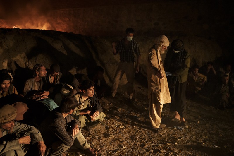 APTOPIX Afghanistan Drugs Drug users detained during a Taliban raid wait to be checked at a police station before being transferred to the Avicenna Medical Hospital for Drug Treatment in Kabul, Afghanistan, Friday, Oct. 1, 2021. At least 150 men were taken to the district police station, where all their belongings -- drugs, wallets, knifes, rings, lighters, a juice box -- were burned in a pile since they are forbidden to take them to the treatment center. (AP Photo/Felipe Dana)