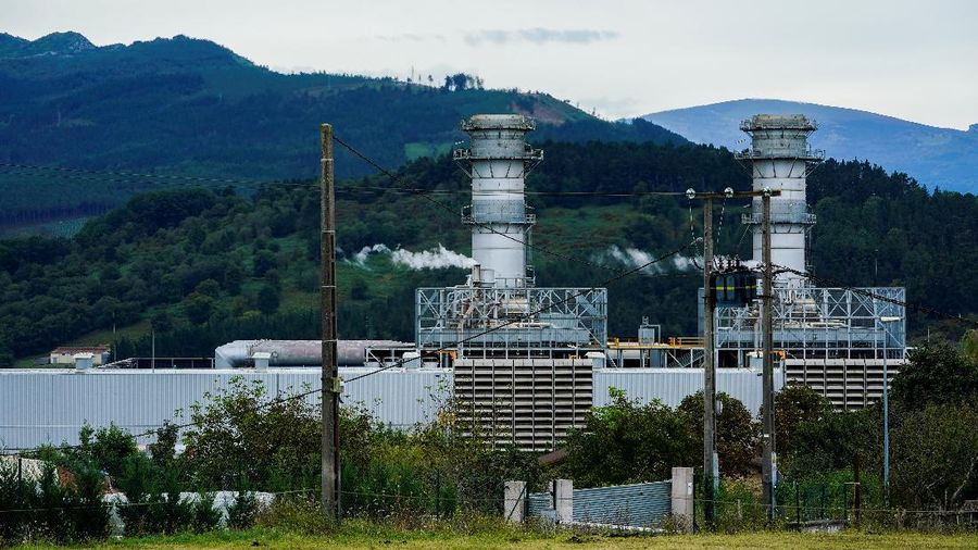 Vapor comes out from chimneys at the Boroa combined cycle gas turbine (CCGT) power plant in Amorebieta, Spain, September 14, 2021. REUTERS/Vincent West