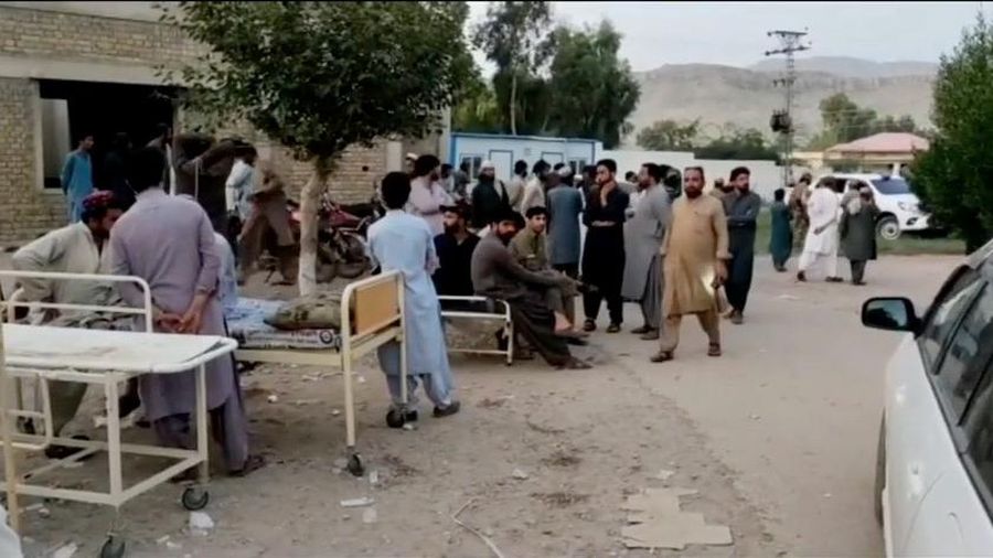 People gather outside a hospital following an earthquake in Harnai, Balochistan, Pakistan, October 7, 2021, in this still image obtained from video. Courtesy of QuettaVoice.com / Social Media via REUTERS  ATTENTION EDITORS - THIS IMAGE HAS BEEN SUPPLIED BY A THIRD PARTY. NO RESALES. NO ARCHIVE. MANDATORY CREDIT QUETTAVOICE.COM.