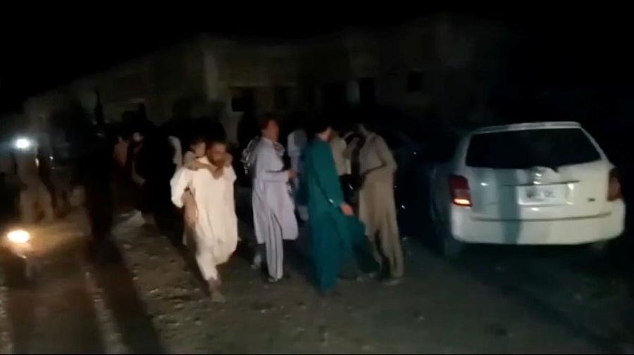People gather outside a hospital following an earthquake in Harnai, Balochistan, Pakistan, October 7, 2021, in this still image obtained from video. Courtesy of QuettaVoice.com / Social Media via REUTERS  ATTENTION EDITORS - THIS IMAGE HAS BEEN SUPPLIED BY A THIRD PARTY. NO RESALES. NO ARCHIVE. MANDATORY CREDIT QUETTAVOICE.COM.