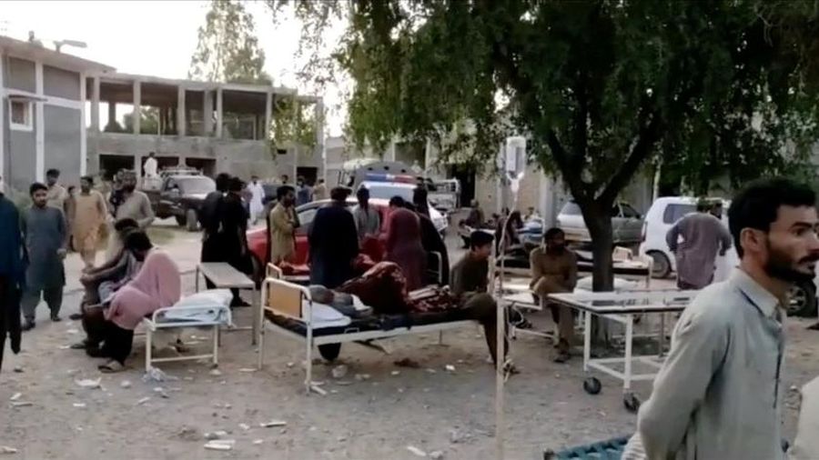 People gather outside a hospital following an earthquake in Harnai, Balochistan, Pakistan, October 7, 2021, in this still image obtained from video. Courtesy of QuettaVoice.com / Social Media via REUTERS  ATTENTION EDITORS - THIS IMAGE HAS BEEN SUPPLIED BY A THIRD PARTY. NO RESALES. NO ARCHIVE. MANDATORY CREDIT QUETTAVOICE.COM.