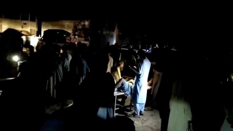 People gather outside a hospital following an earthquake in Harnai, Balochistan, Pakistan, October 7, 2021, in this still image obtained from video. Courtesy of QuettaVoice.com / Social Media via REUTERS  ATTENTION EDITORS - THIS IMAGE HAS BEEN SUPPLIED BY A THIRD PARTY. NO RESALES. NO ARCHIVE. MANDATORY CREDIT QUETTAVOICE.COM.