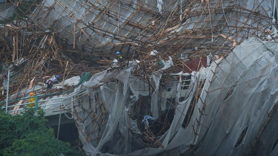 Collapsed bamboo scaffolds of a residential building are seen as Typhoon Lionrock hits Hong Kong, China October 8, 2021. REUTERS/Lam Yik