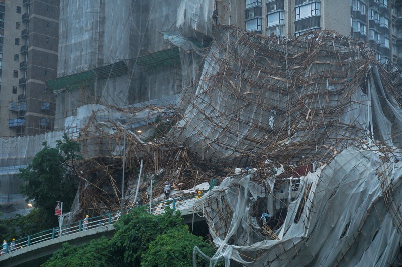 Collapsed bamboo scaffolds of a residential building are seen as Typhoon Lionrock hits Hong Kong, China October 8, 2021. REUTERS/Lam Yik