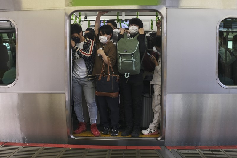 Japan Earthquake Passengers wait in a long line to get into JR Kawaguchi station in Kawaguchi, near Tokyo Friday, Oct. 8, 2021. Entry to the station was restricted due to aftermath of Thursday's strong earthquake. (Kyodo News via AP)