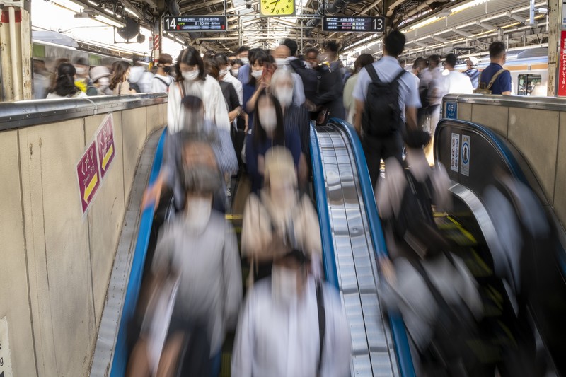 Japan Earthquake Passengers wait in a long line to get into JR Kawaguchi station in Kawaguchi, near Tokyo Friday, Oct. 8, 2021. Entry to the station was restricted due to aftermath of Thursday's strong earthquake. (Kyodo News via AP)