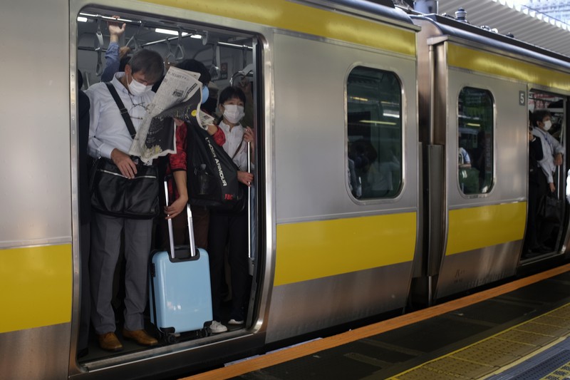 Japan Earthquake Passengers wait in a long line to get into JR Kawaguchi station in Kawaguchi, near Tokyo Friday, Oct. 8, 2021. Entry to the station was restricted due to aftermath of Thursday's strong earthquake. (Kyodo News via AP)