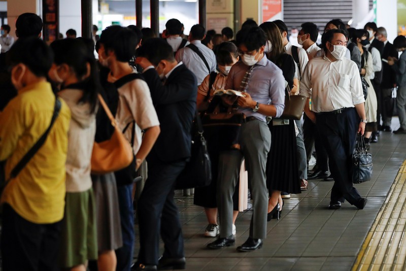Japan Earthquake Passengers wait in a long line to get into JR Kawaguchi station in Kawaguchi, near Tokyo Friday, Oct. 8, 2021. Entry to the station was restricted due to aftermath of Thursday's strong earthquake. (Kyodo News via AP)