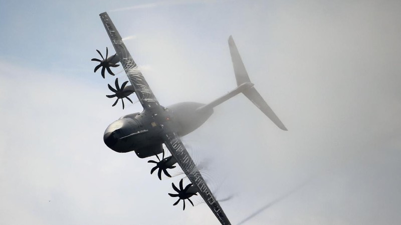 An Indonesian Air Force soldier guards in front of British air force RAF A400M transport aircraft during a visit at Halim Perdanakusuma airport in Jakarta, Indonesia, Tuesday, Nov. 12, 2019.(AP Photo/Achmad Ibrahim)