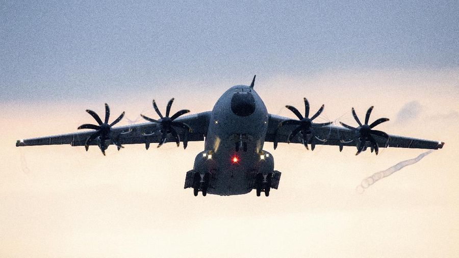 An Indonesian Air Force soldier guards in front of British air force RAF A400M transport aircraft during a visit at Halim Perdanakusuma airport in Jakarta, Indonesia, Tuesday, Nov. 12, 2019.(AP Photo/Achmad Ibrahim)
