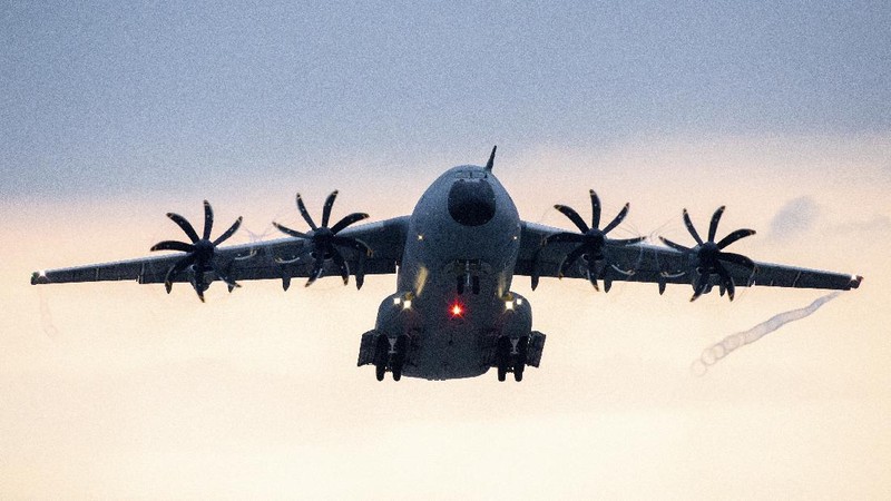 An Indonesian Air Force soldier guards in front of British air force RAF A400M transport aircraft during a visit at Halim Perdanakusuma airport in Jakarta, Indonesia, Tuesday, Nov. 12, 2019.(AP Photo/Achmad Ibrahim)