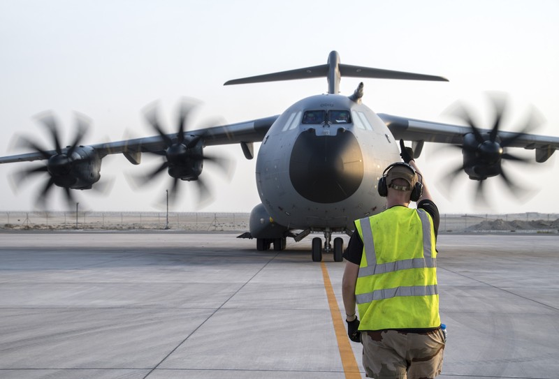 An Indonesian Air Force soldier guards in front of British air force RAF A400M transport aircraft during a visit at Halim Perdanakusuma airport in Jakarta, Indonesia, Tuesday, Nov. 12, 2019.(AP Photo/Achmad Ibrahim)