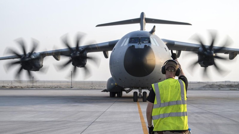 In this photo provided Tuesday Aug.17, 2021 by the French Defense Ministry, a French soldier directs a military Airbus A400M after landing in Abu Dhabi, Monday, Aug.16, 2021. France is relocating its embassy in Kabul to the airport to evacuate all citizens still in Afghanistan, initially transferring them to Abu Dhabi. Evacuations have been in progress for weeks and a charter flight put in place by France in mid-July. (Etat-Major des Armees via AP)