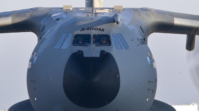 An Indonesian Air Force soldier guards in front of British air force RAF A400M transport aircraft during a visit at Halim Perdanakusuma airport in Jakarta, Indonesia, Tuesday, Nov. 12, 2019.(AP Photo/Achmad Ibrahim)
