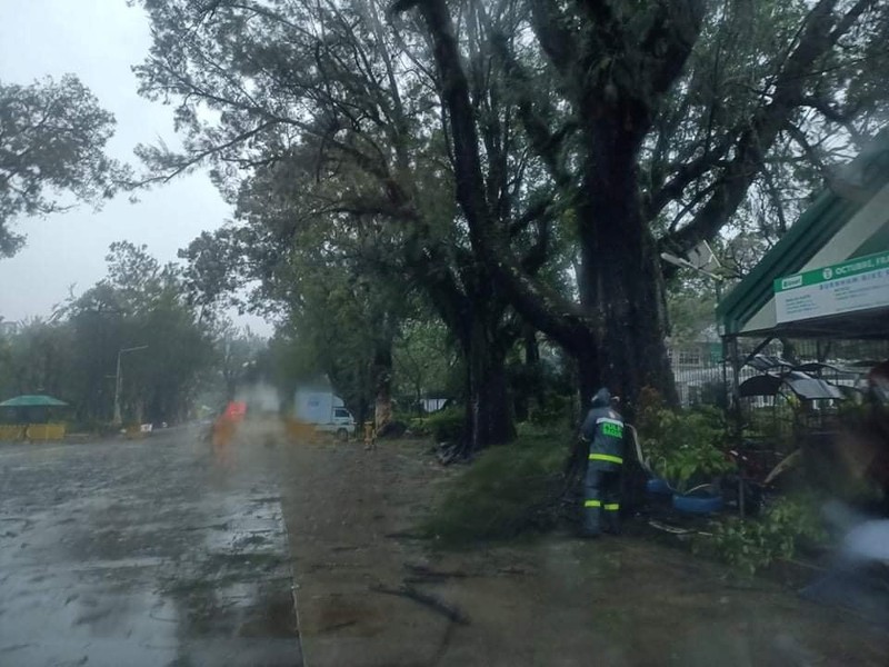 In this photo released by the Gonzaga Municipal Disaster Risk Reduction and Management Office, a resident is pulled along a rope as rescuers wait on the other side of a swollen river caused by heavy rains from Tropical Storm Kompasu in Gonzaga town, Cagayan province, northern Philippines, Monday Oct. 11, 2021. A number of people have been killed and others were reported missing in landslides and flash flood set off by a storm that barreled through the tip of the northern Philippines overnight then blew away Tuesday, officials said. (Gonzaga MDRRMO via AP)