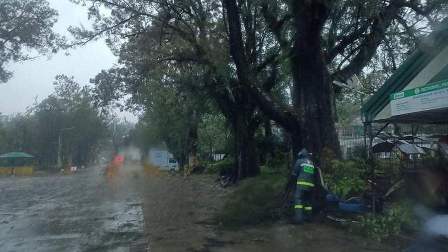 In this photo released by the Gonzaga Municipal Disaster Risk Reduction and Management Office, a resident is pulled along a rope as rescuers wait on the other side of a swollen river caused by heavy rains from Tropical Storm Kompasu in Gonzaga town, Cagayan province, northern Philippines, Monday Oct. 11, 2021. A number of people have been killed and others were reported missing in landslides and flash flood set off by a storm that barreled through the tip of the northern Philippines overnight then blew away Tuesday, officials said. (Gonzaga MDRRMO via AP)