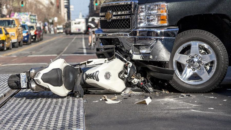 San Francisco, USA - January 23, 2014: A bad traffic accident between a white Ducati motorcycle and Chevy pickup truck occurred on Market street in the late afternoon and brought traffic to a halt, backing up Muni buses and light rain trains. No fatalities were reported.