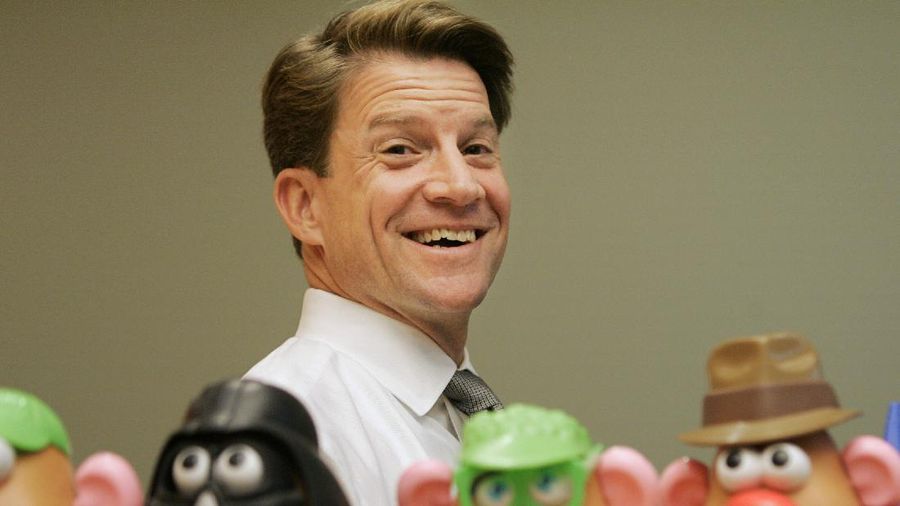 FILE - In this Tuesday, May 20, 2008, file photo, Brian Goldner, of Hasbro, stands next to some of the company's toy figures at Hasbro's headquarters, in Pawtucket, R.I. Toy and entertainment company Hasbro has announced that its CEO and chairman Brian D. Goldner has died at age 58. The announcement Tuesday, Oct. 12, 2021, comes two days after the company said Goldner was taking a medical leave of absence from his CEO role, effective immediately. (AP Photo/Steven Senne, File)