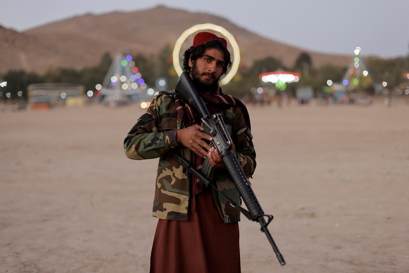 Taliban fighters get out of a vehicle as they take a day off to visit the amusement park at Kabul's Qargha reservoir, at the outskirts of Kabul, Afghanistan October 8, 2021. Picture taken October 8, 2021. REUTERS/Jorge Silva     TPX IMAGES OF THE DAY