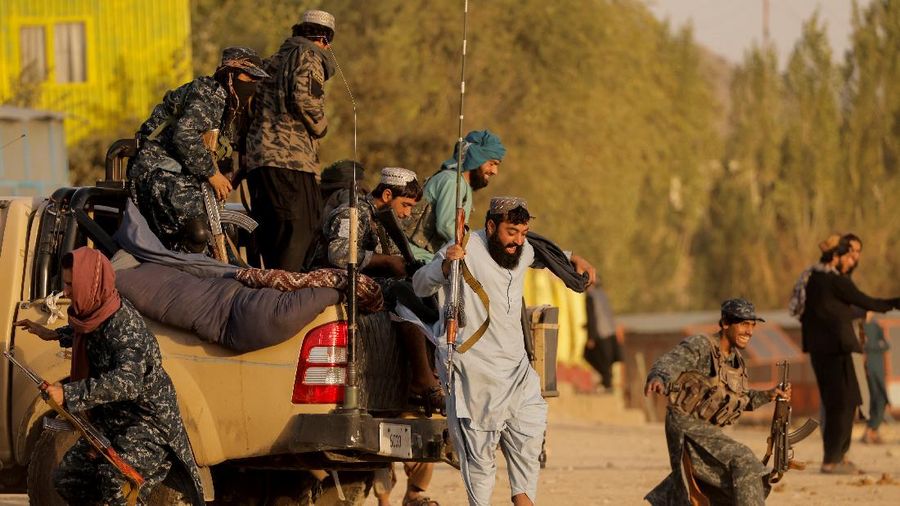 Taliban fighters get out of a vehicle as they take a day off to visit the amusement park at Kabul's Qargha reservoir, at the outskirts of Kabul, Afghanistan October 8, 2021. Picture taken October 8, 2021. REUTERS/Jorge Silva     TPX IMAGES OF THE DAY