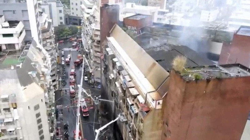 In this image taken from video by Taiwan's EBC, firefighters battle a blaze at a building in Kaohsiung, in southern Taiwan on Thursday, Oct. 14, 2021. A fire engulfed a 13-story building overnight in southern Taiwan, the island’s semi-official Central News Agency reported Thursday. (EBC via AP )
