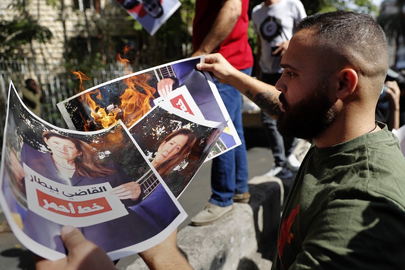 Lebanon A supporter of the Shiite Hezbollah and Amal groups burns posters that show the U.S. Ambassador to Lebanon Dorothy Shea, and Arabic that reads: