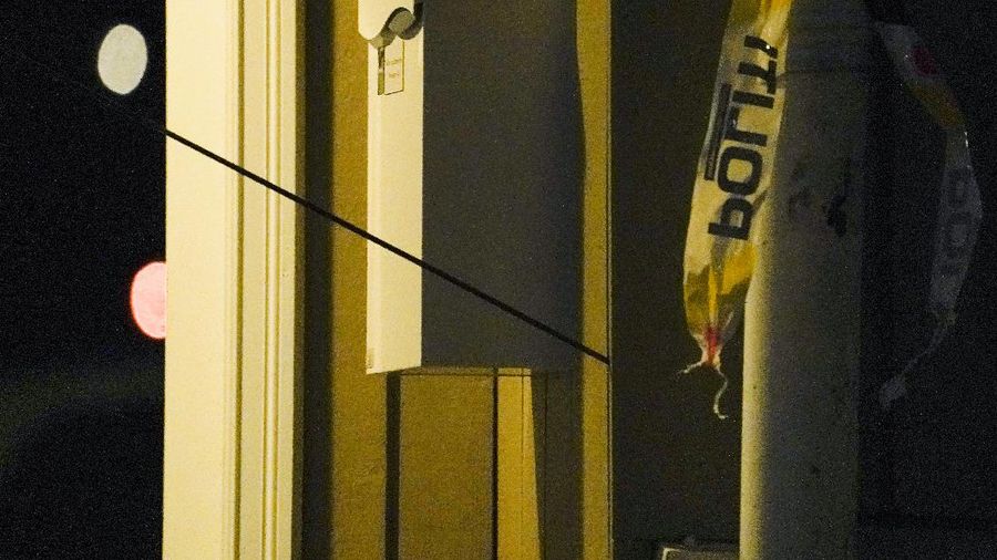 Police stand at the scene after an attack in Kongsberg, Norway, Wednesday, Oct. 13, 2021. Several people have been killed and others injured by a man armed with a bow and arrow in a town west of the Norwegian capital, Oslo. (Hakon Mosvold Larsen/NTB Scanpix via AP)