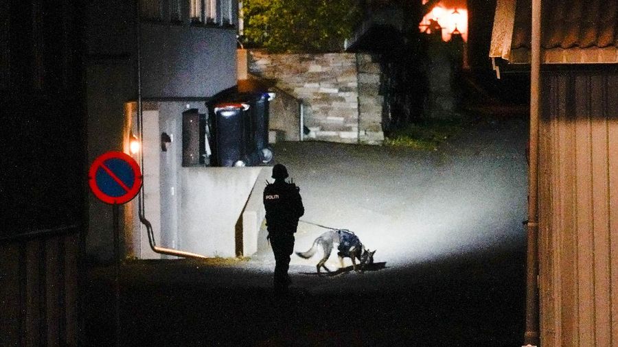 Police stand at the scene after an attack in Kongsberg, Norway, Wednesday, Oct. 13, 2021. Several people have been killed and others injured by a man armed with a bow and arrow in a town west of the Norwegian capital, Oslo. (Hakon Mosvold Larsen/NTB Scanpix via AP)
