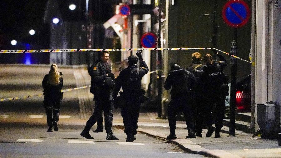 Police stand at the scene after an attack in Kongsberg, Norway, Wednesday, Oct. 13, 2021. Several people have been killed and others injured by a man armed with a bow and arrow in a town west of the Norwegian capital, Oslo. (Hakon Mosvold Larsen/NTB Scanpix via AP)