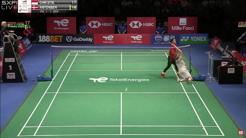 Indonesia's Anthony Sinisuka Ginting returns the shuttlecock to Denmark's Viktor Axelsen during a mens single match in the Thomas Cup mens team Badminton semifinal match between Denmark and Indonesia, in Aarhus, Denmark, Saturday Oct. 16, 2021. (Claus Fisker/Ritzau Scanpix via AP)