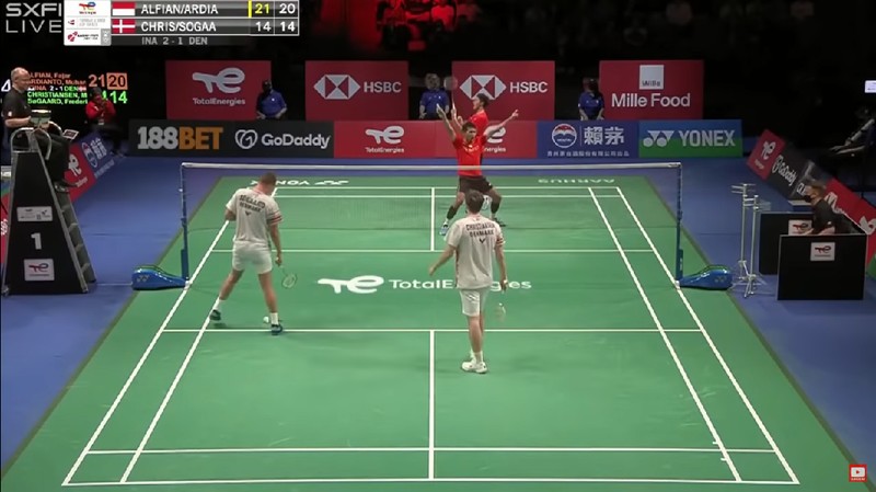 Indonesia's Anthony Sinisuka Ginting returns the shuttlecock to Denmark's Viktor Axelsen during a mens single match in the Thomas Cup mens team Badminton semifinal match between Denmark and Indonesia, in Aarhus, Denmark, Saturday Oct. 16, 2021. (Claus Fisker/Ritzau Scanpix via AP)