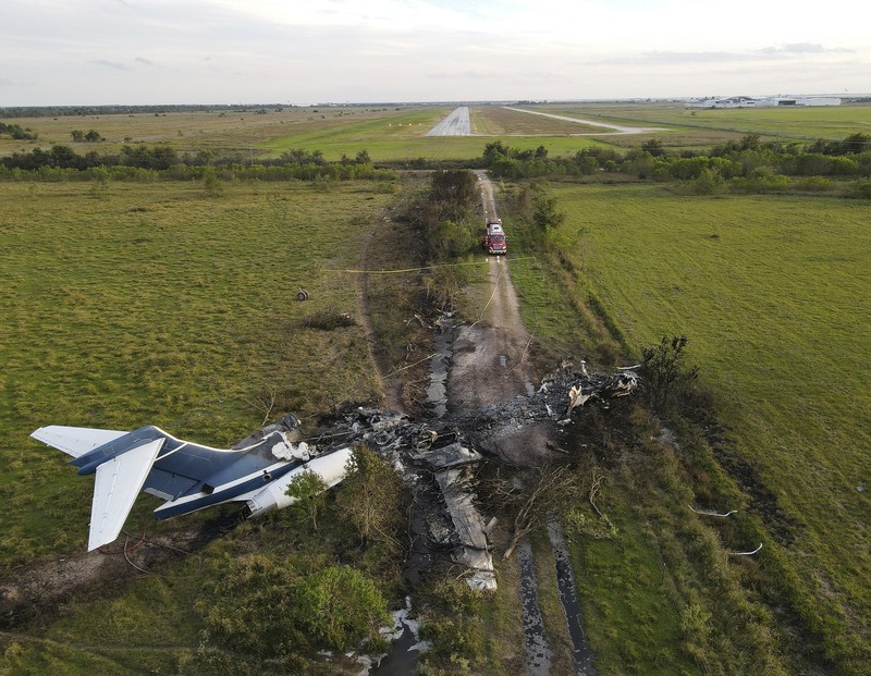 In this frame grab from video provided by KTRK, firefighters work the scene where a plane taking passengers from Texas to the AL Championship Series game in Boston burst into flames after it ran off a runway during takeoff Tuesday, Oct. 19, 2021, in Brookshire, Texas. No one was seriously hurt, authorities said. (KTRK via AP)