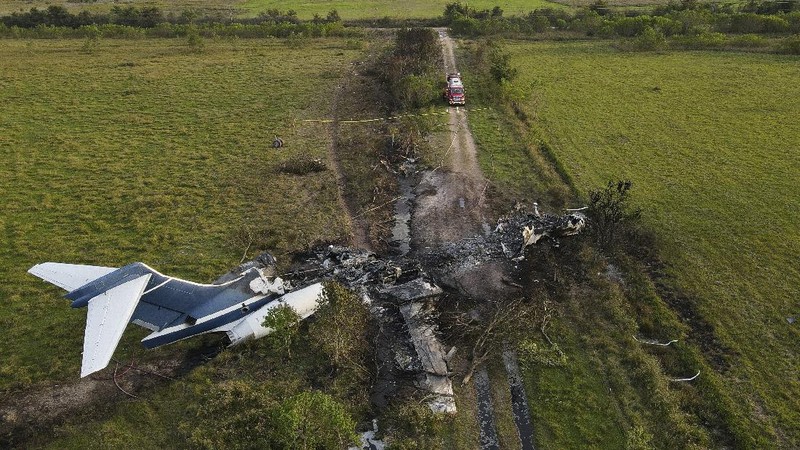 In this frame grab from video provided by KTRK, firefighters work the scene where a plane taking passengers from Texas to the AL Championship Series game in Boston burst into flames after it ran off a runway during takeoff Tuesday, Oct. 19, 2021, in Brookshire, Texas. No one was seriously hurt, authorities said. (KTRK via AP)