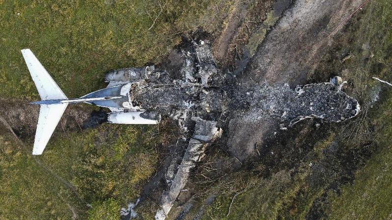 In this frame grab from video provided by KTRK, firefighters work the scene where a plane taking passengers from Texas to the AL Championship Series game in Boston burst into flames after it ran off a runway during takeoff Tuesday, Oct. 19, 2021, in Brookshire, Texas. No one was seriously hurt, authorities said. (KTRK via AP)