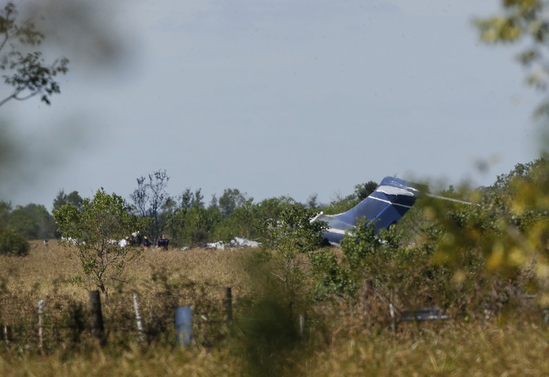 In this frame grab from video provided by KTRK, firefighters work the scene where a plane taking passengers from Texas to the AL Championship Series game in Boston burst into flames after it ran off a runway during takeoff Tuesday, Oct. 19, 2021, in Brookshire, Texas. No one was seriously hurt, authorities said. (KTRK via AP)