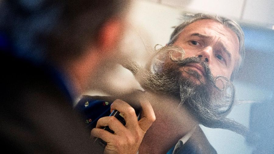 Participant Norbert Dopf from Austria arrives for the German Moustache and Beard Championships 2021 at Pullman City Western Theme Park in Eging am See, Germany, October 23, 2021. REUTERS/Lukas Barth     TPX IMAGES OF THE DAY