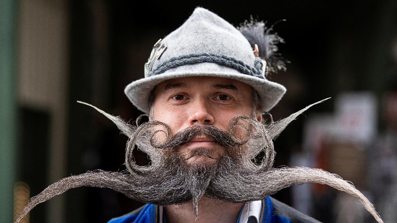 Participant Norbert Dopf from Austria arrives for the German Moustache and Beard Championships 2021 at Pullman City Western Theme Park in Eging am See, Germany, October 23, 2021. REUTERS/Lukas Barth     TPX IMAGES OF THE DAY