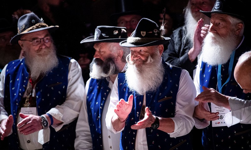 Peserta kejuaraan kumis dan jenggot Jerman 2021 Participant Norbert Dopf from Austria arrives for the German Moustache and Beard Championships 2021 at Pullman City Western Theme Park in Eging am See, Germany, October 23, 2021. REUTERS/Lukas Barth TPX IMAGES OF THE DAY