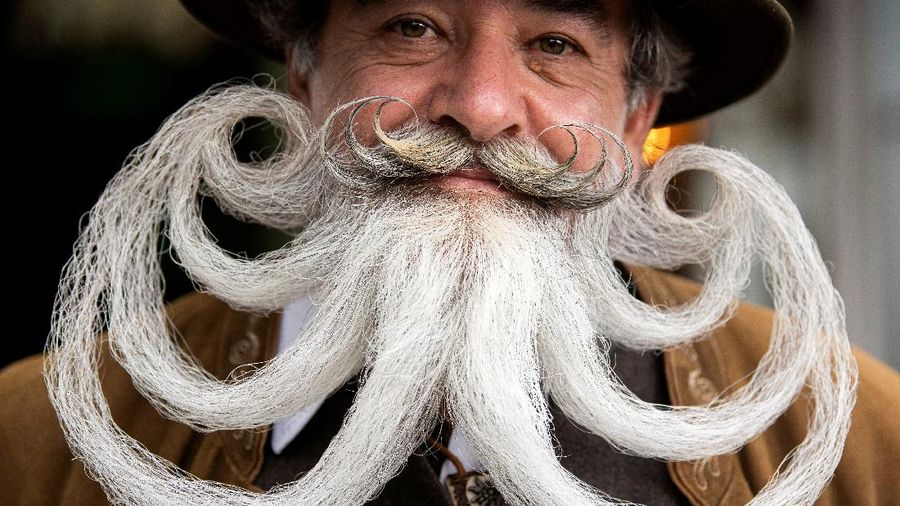Participant Norbert Dopf from Austria arrives for the German Moustache and Beard Championships 2021 at Pullman City Western Theme Park in Eging am See, Germany, October 23, 2021. REUTERS/Lukas Barth     TPX IMAGES OF THE DAY